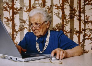 old-woman-using-laptop-300x217.jpg